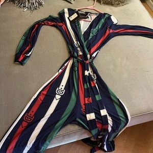 Multi color jumpsuit colors are blue white green and red